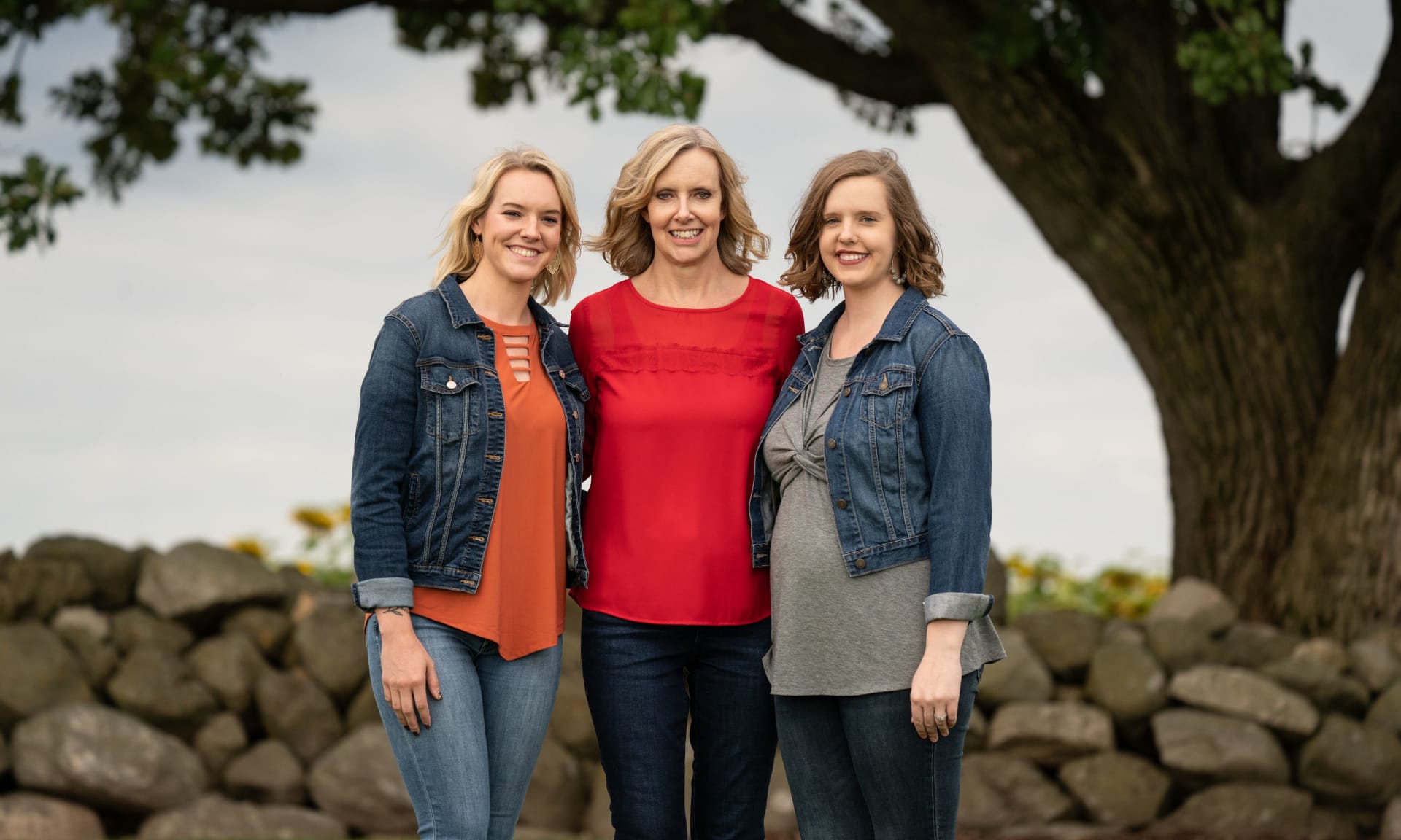Muenchow 408320-8394.jpg A mother standing with her twin daughters