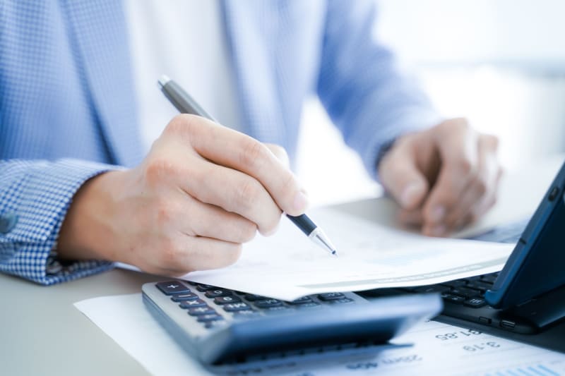 Business,Partners,Discussing,Documents,And,Ideas,At,Meeting Financial planning
