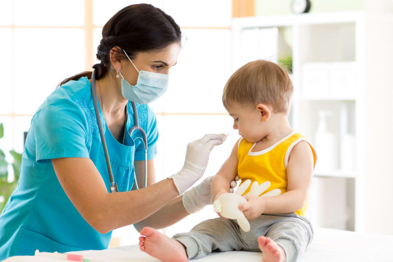 shutterstock_645639754 Nurse giving toddler an immunization