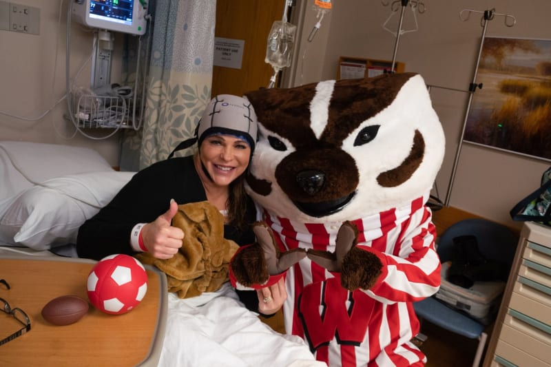 B6 Bucky 259348-1013.jpg Patient wearing cooling cap with Bucky Badger