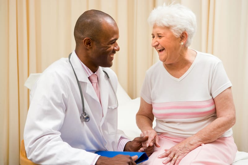 shutterstock_14464498 Older patient laughing with provider