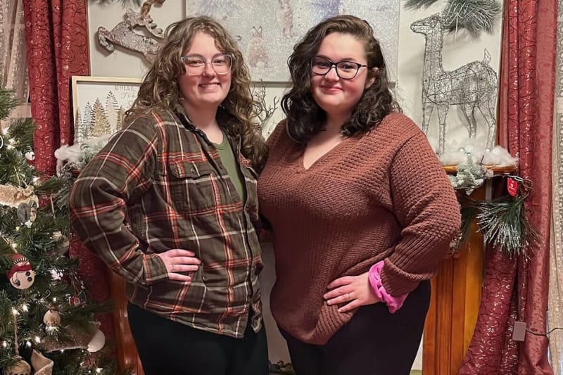 Two women, Sophia and Emily Johnston, standing next to each other smiling.