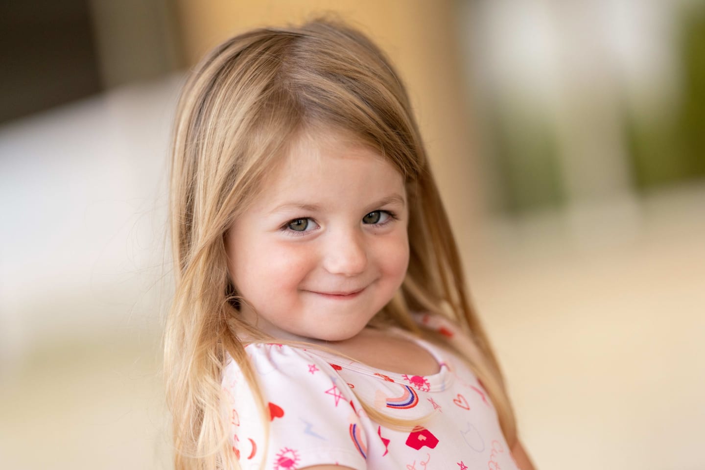 A little girl with dark blonde hair