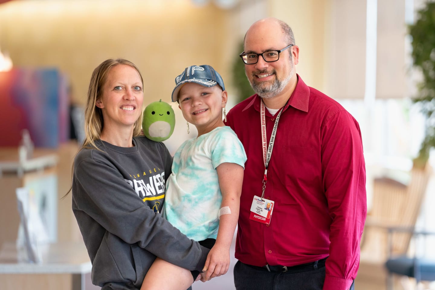 Scarlett Griffith with her mother, Tami, and UW Health pediatric oncologist Christian Capitini