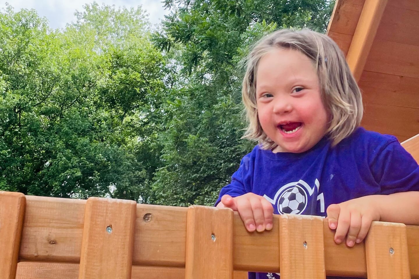 Syvlia Gerlach smiling on a playground.