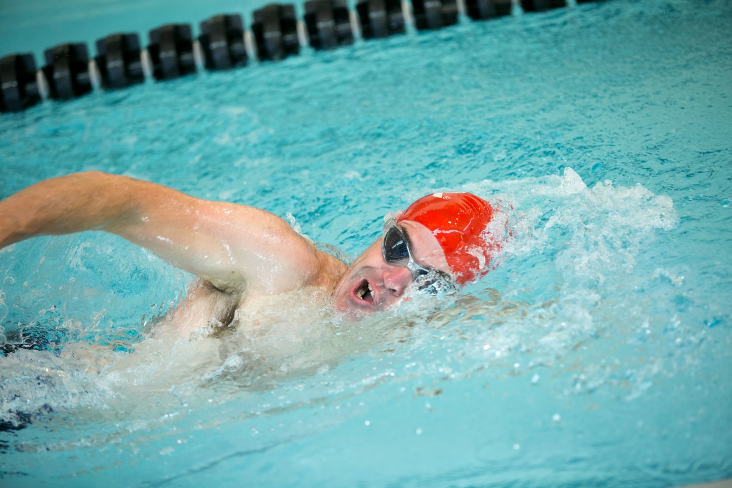 A swimmer breathing while simming freestyle