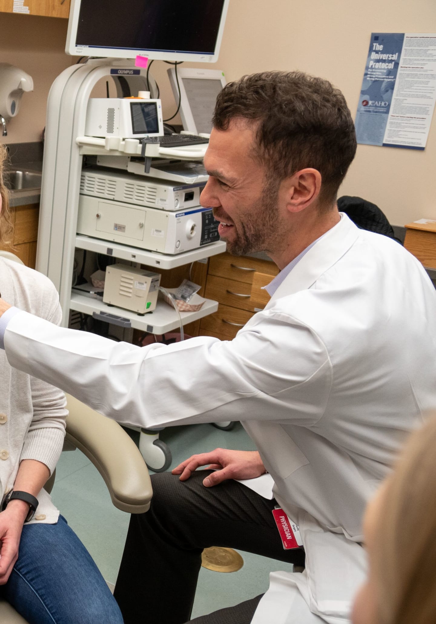 A physician examing a patient's face