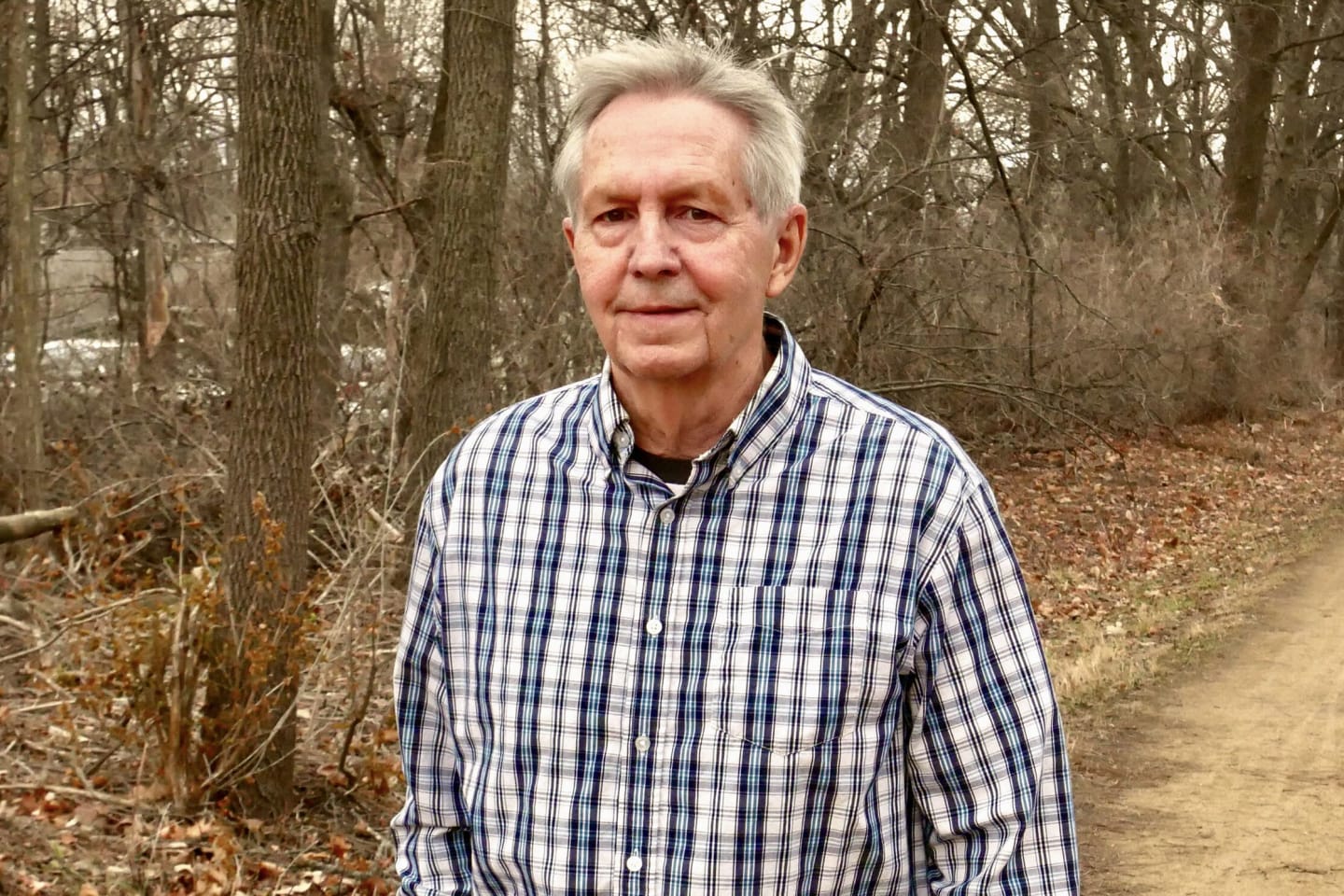 Rob Zaleksi walking on a trail in the woods