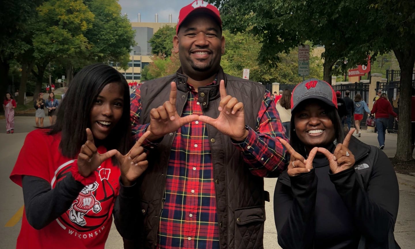 Jamila Hudson and her family show the Badger W