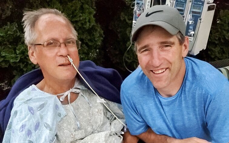 Richard Gillette in a wheel chair next to his Brian Forrest