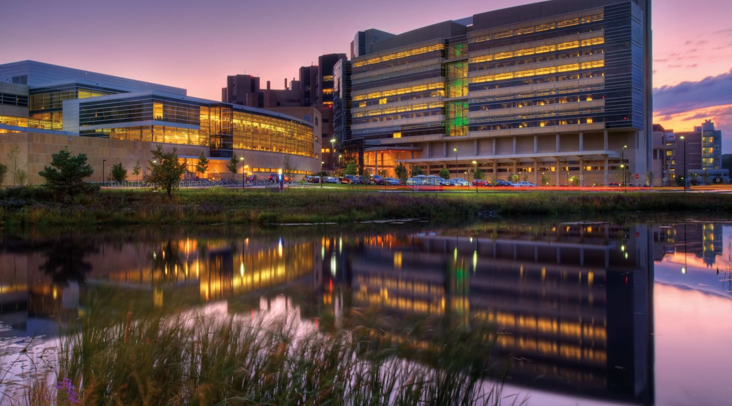 The lighted exterior of the Health Sciences Learning Center and Wisconsin Institutes for Discovery