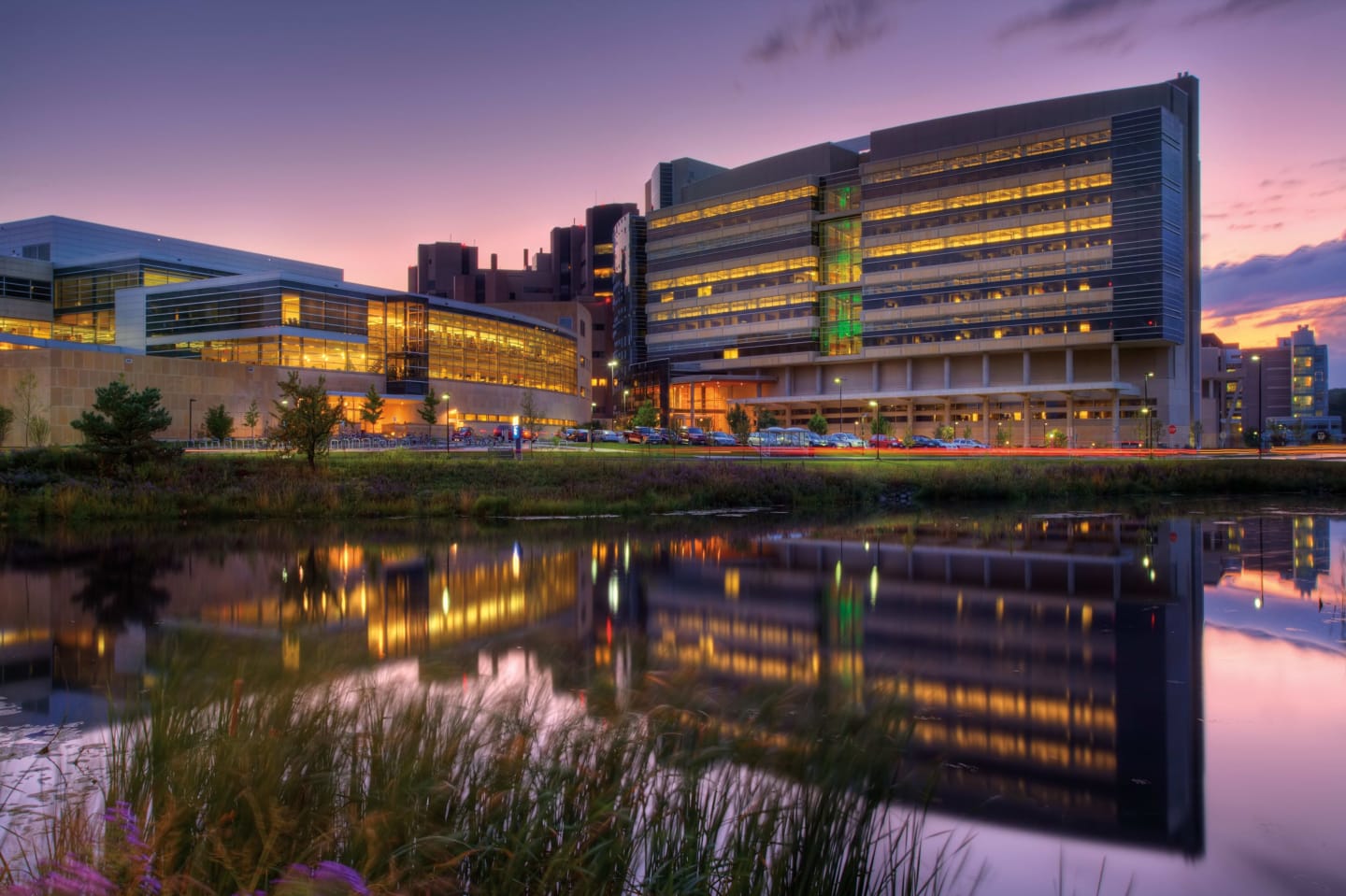 The lighted exterior of the Health Sciences Learning Center and Wisconsin Institutes for Discovery