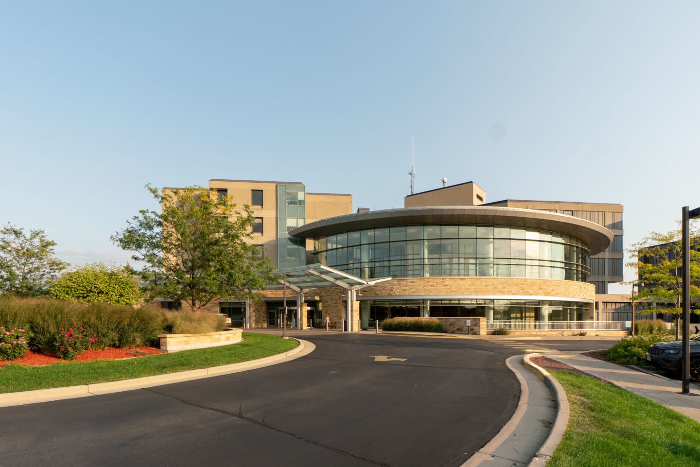 The rounded glass and sandy-colored exterior of Mercy Regional Heart and Vascular Center