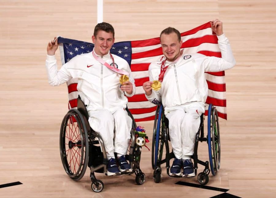 John Boie holding his Paralympic gold medal