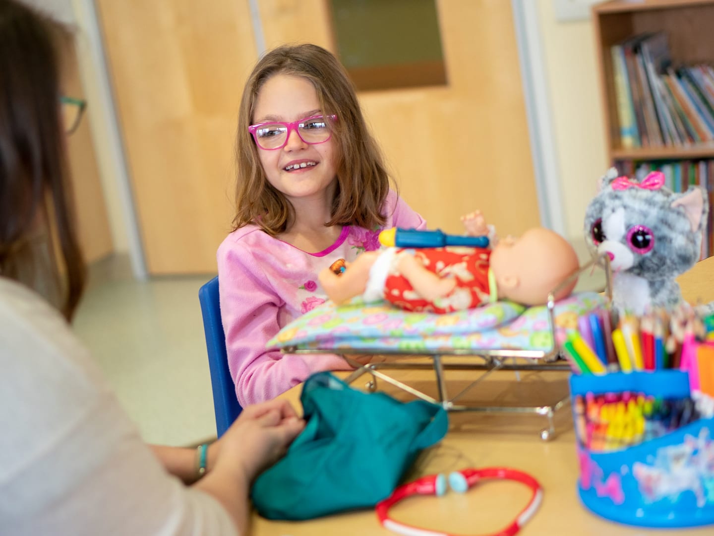 A child playing with a doll