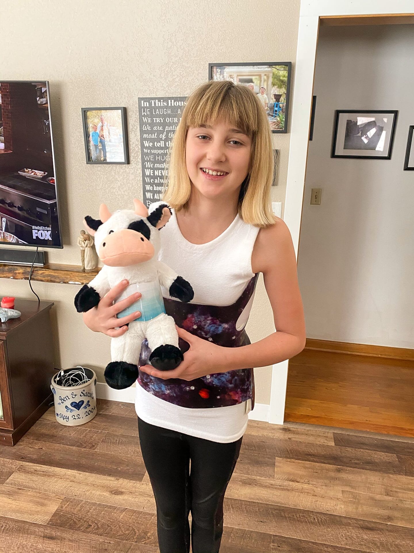 A photo of Dani Olson wearing a back brace
