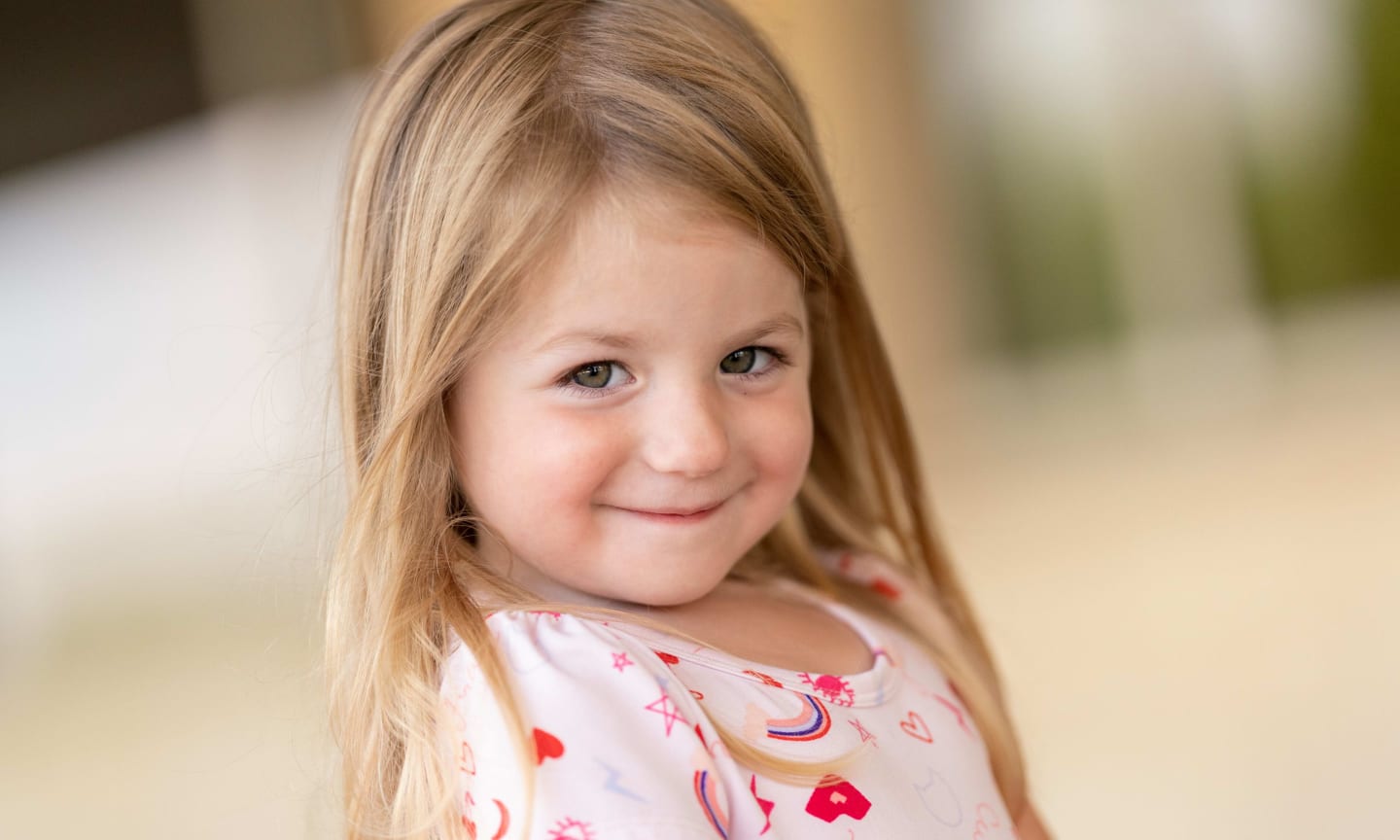 A little girl with dark blonde hair