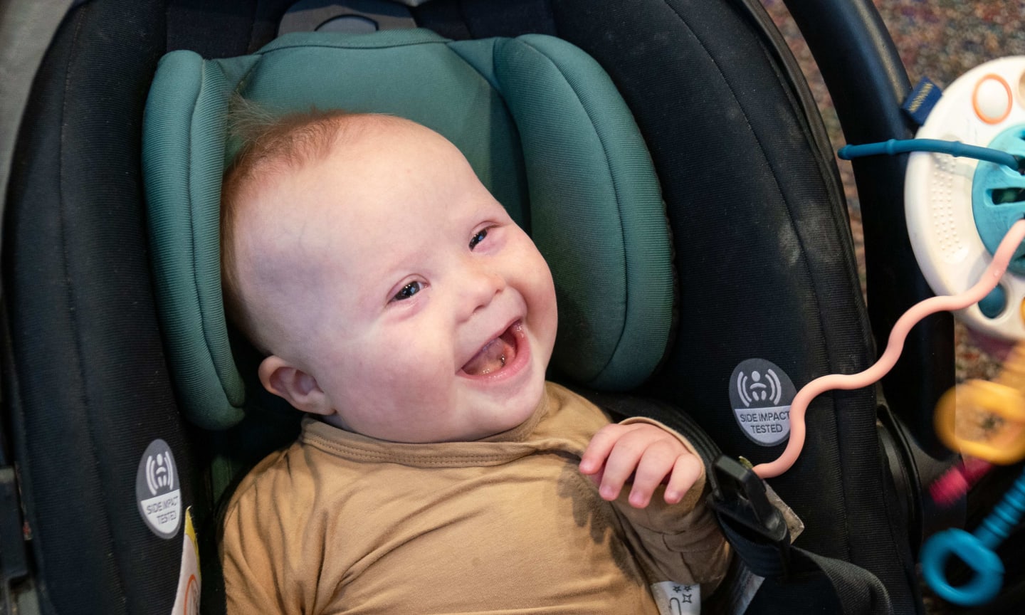 A young baby in a car seat