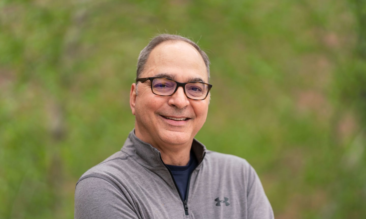 Doug Greer smiling outdoors