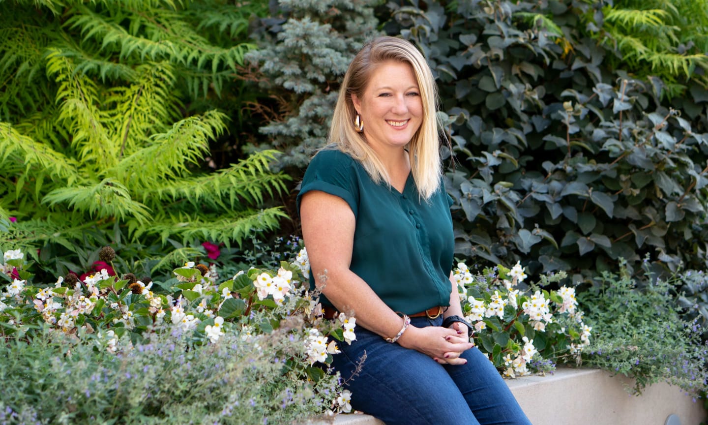 Brooke Dupree portrait in front of greenery