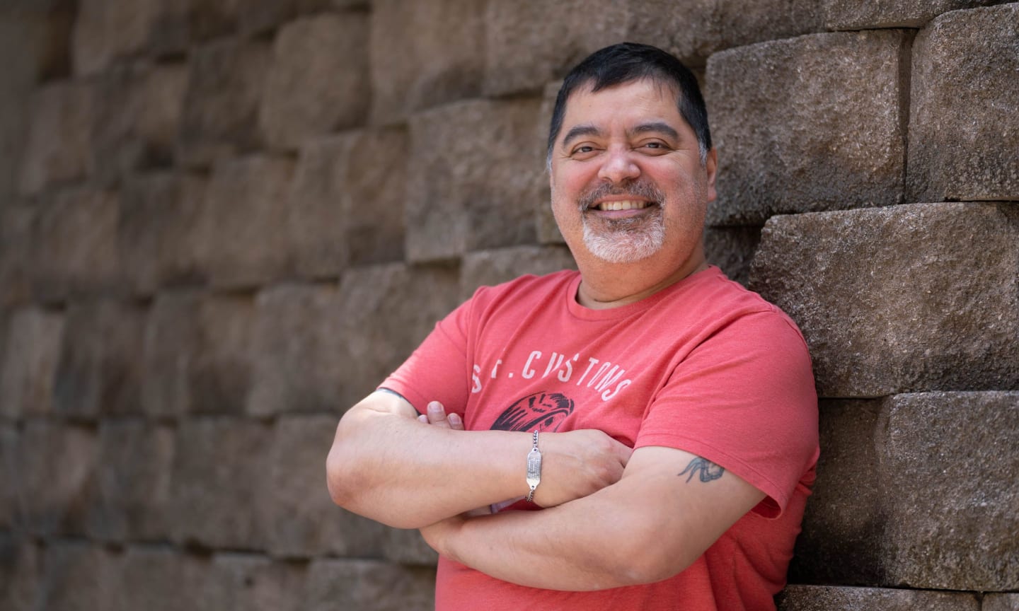 Joe Hernandez smiling outdoors.