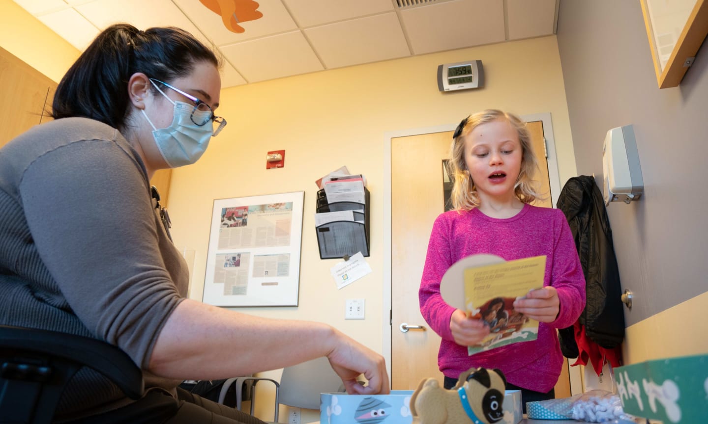 A child working with a speech language pathologist