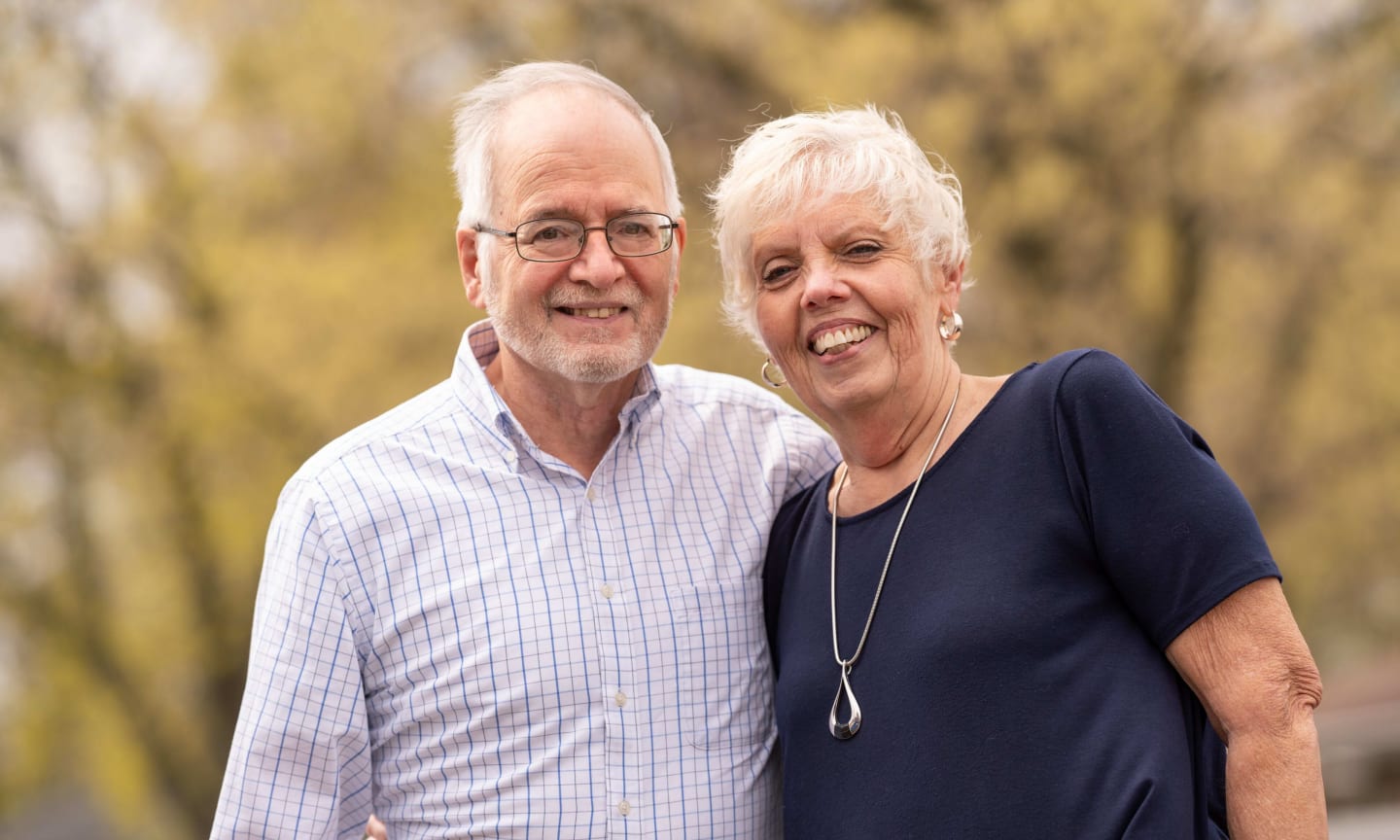 Jim and Michelle Schmaling standing outside on a fall day