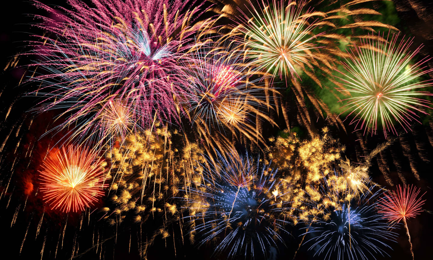 Colorful fireworks of various colors over night sky