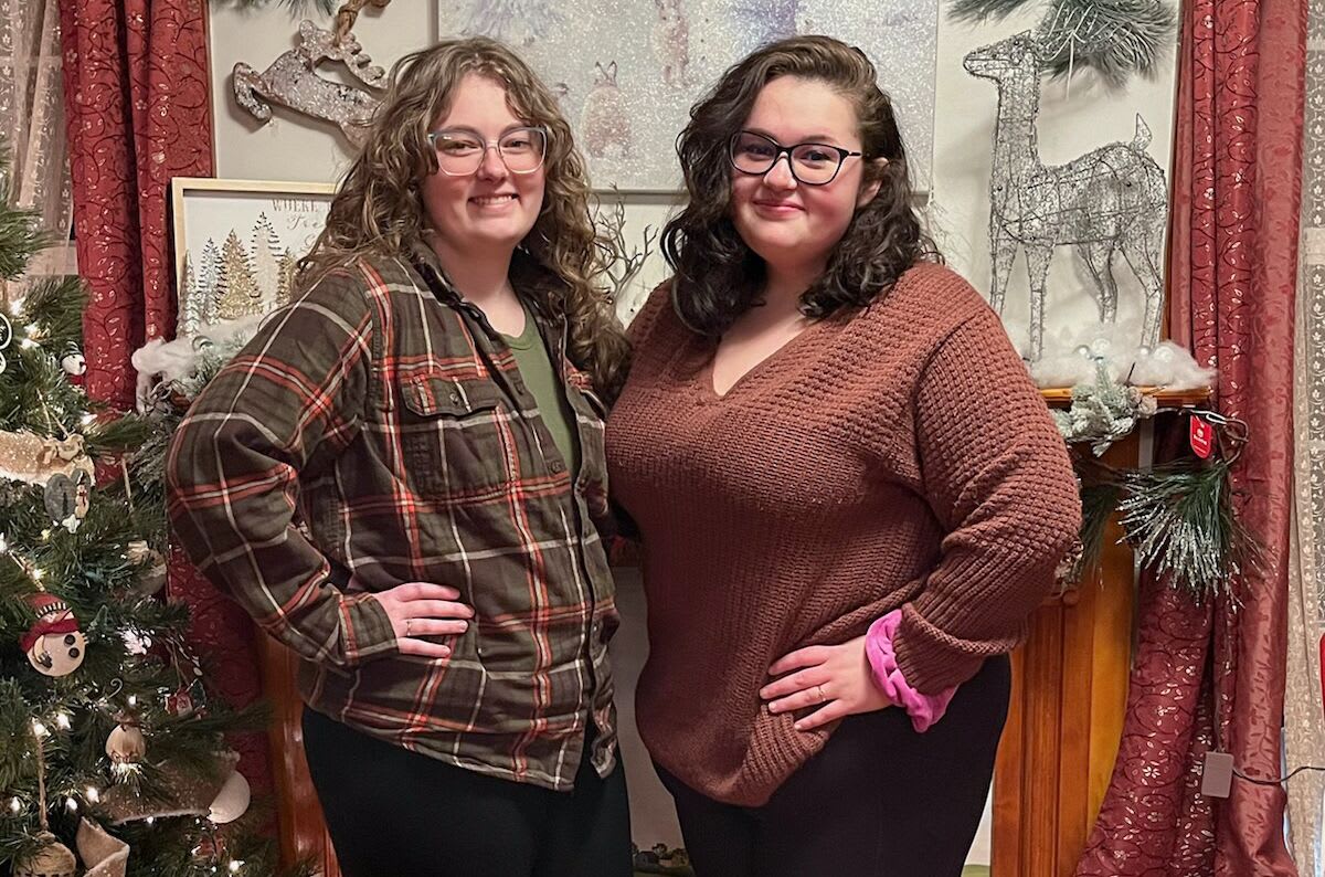 Two women, Sophia and Emily Johnston, standing next to each other smiling.