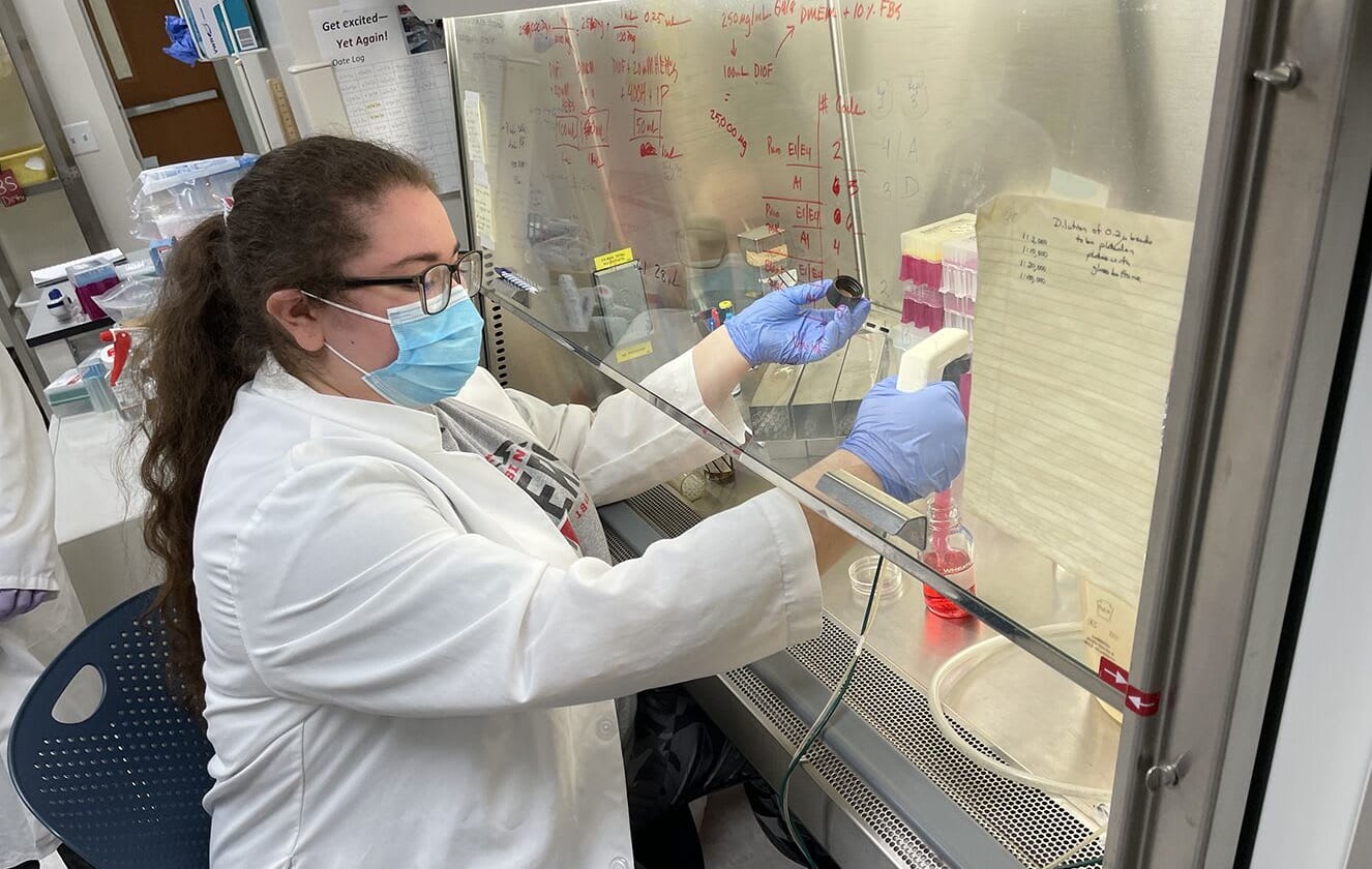 Isabella Castellano-Moen in a laboratory