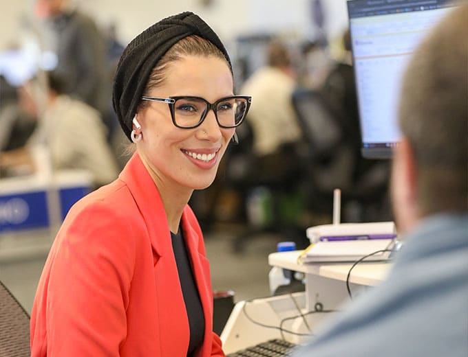 An Account Executive in Sales helping a client
