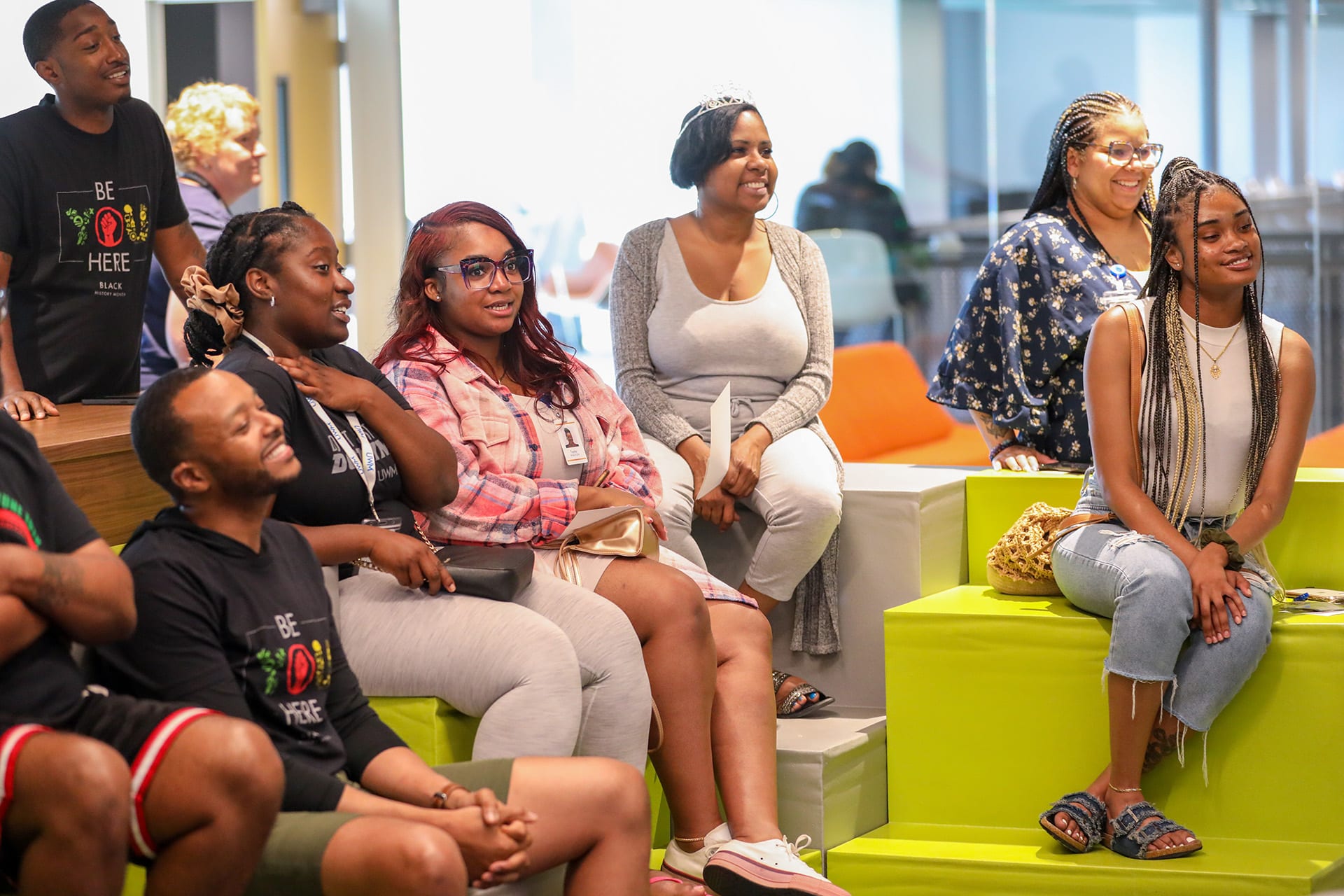 Team members gathered in a comfortable lounge for a presentation