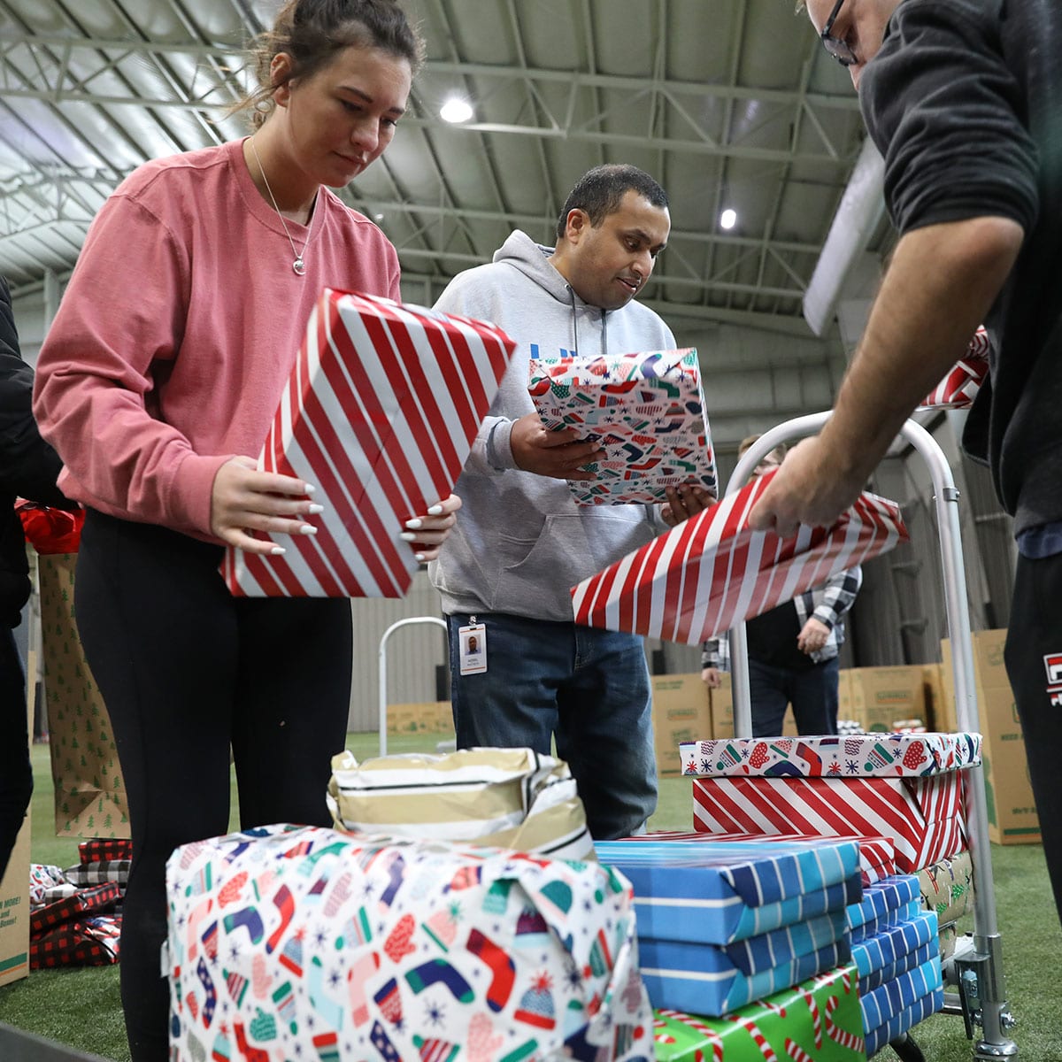 Team members packing gifts for Adopt A Family