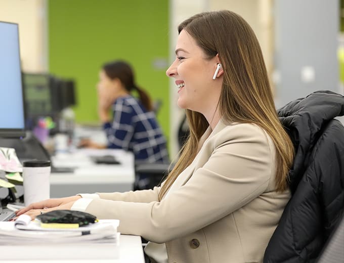 A happy Finance team member at a deck