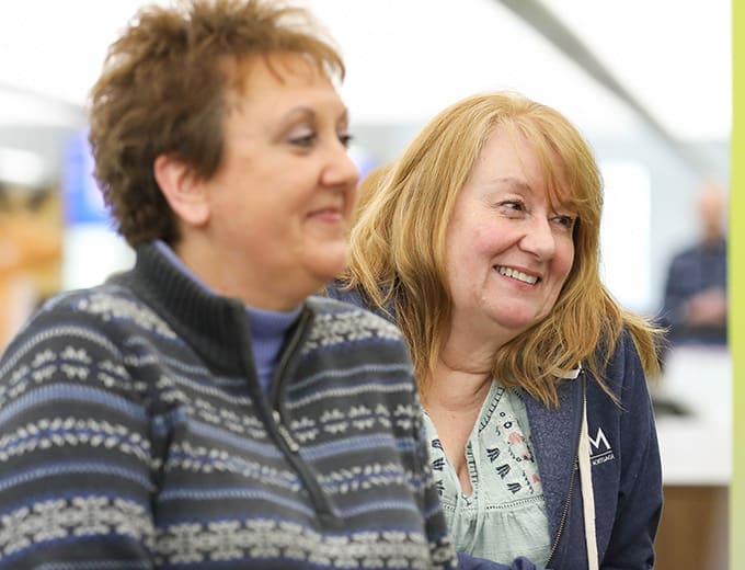 Two happy Internal Audit team members