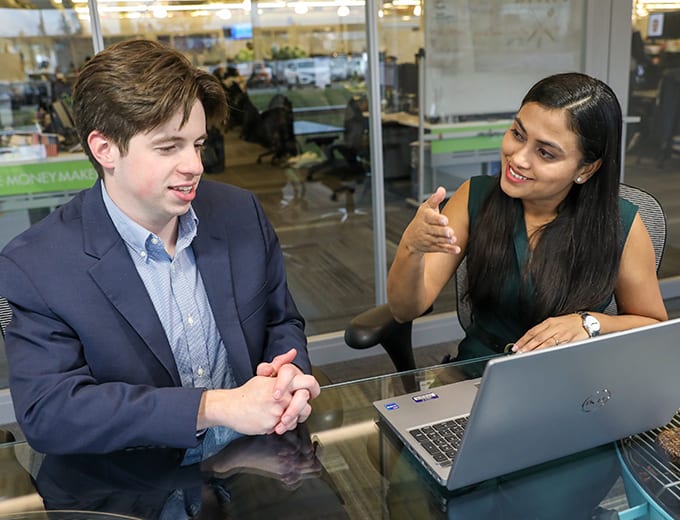 An Investor Relations team member talking with a UWM investor