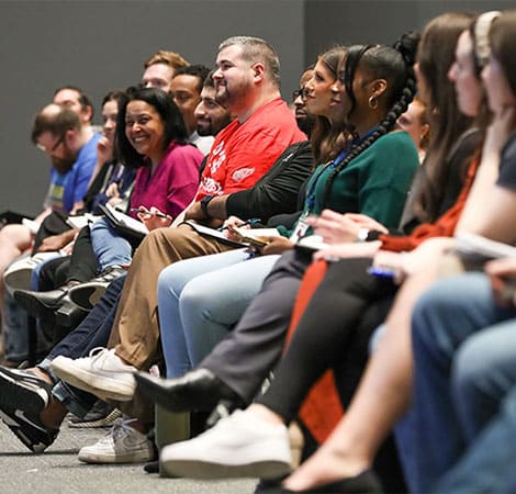 UWM team member Veterans sitting in a row for a presentation