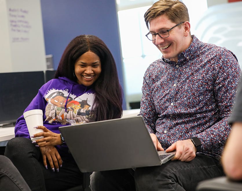 Two Technology team members going through the Dev-X program