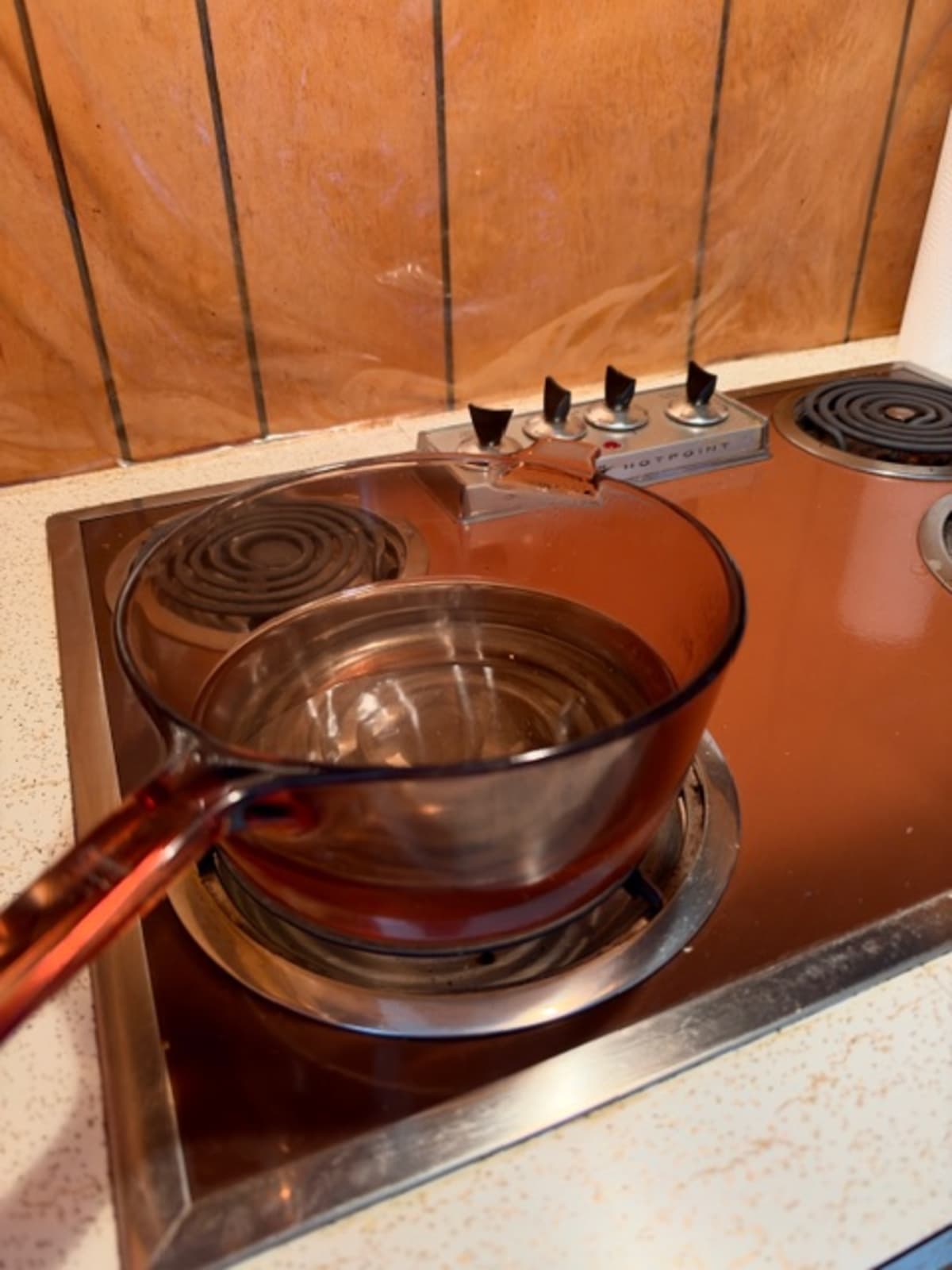My Mema's Corning Visions glass pot of water on her Hotpoint coil stove