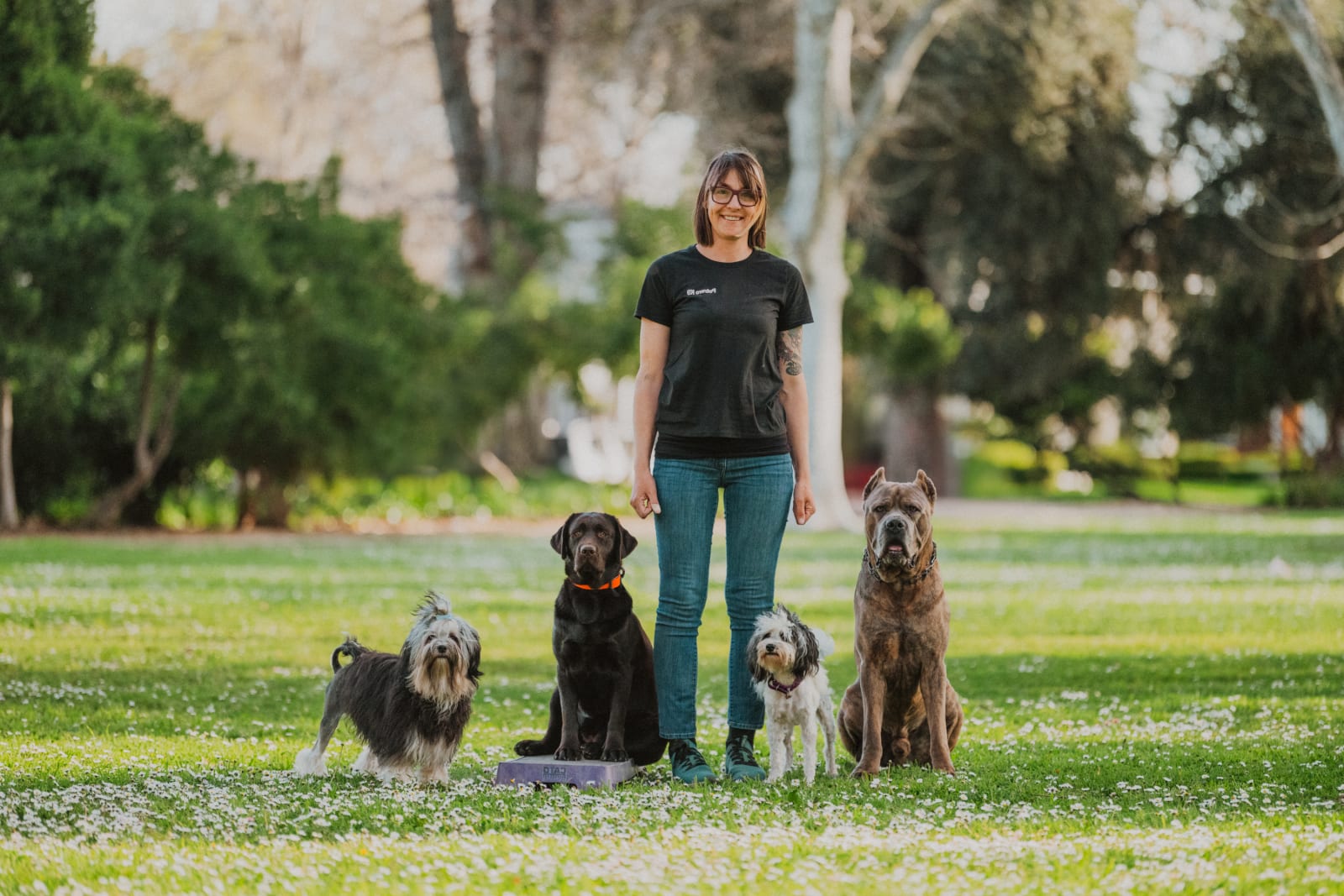 Dog trainer Alexia Rodriguez with her dogs at a park in Roseville, California