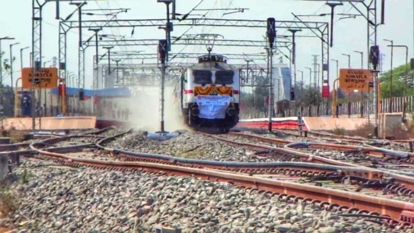 CRS rake skipping KRLA station in return from Morthad, on its first electrified track