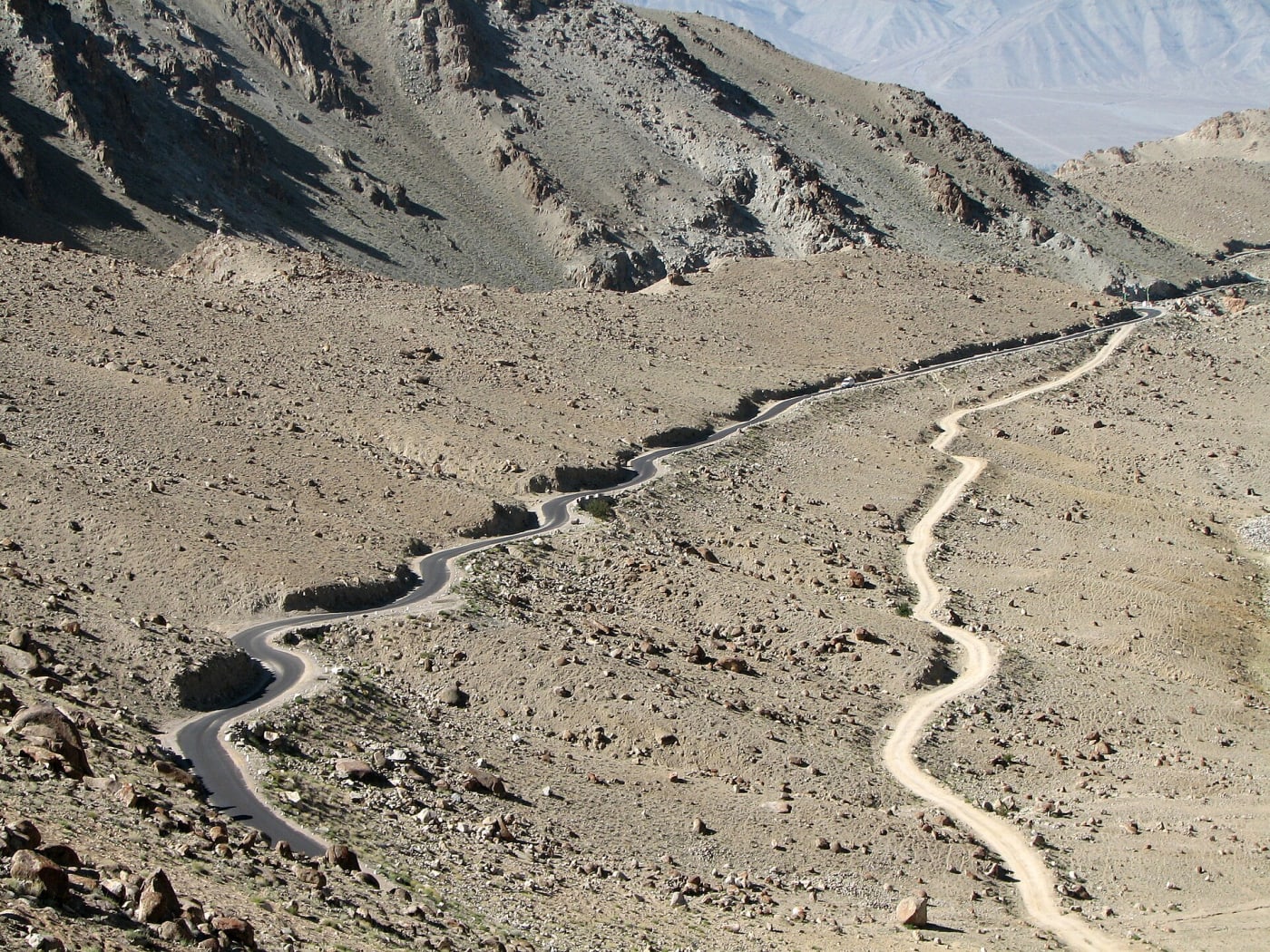 Two roads in en:Ladakh in the en:Indian Himalayas , one surfaced , the other not, run into each other. Snaking Roads ...road to Khardungla, 