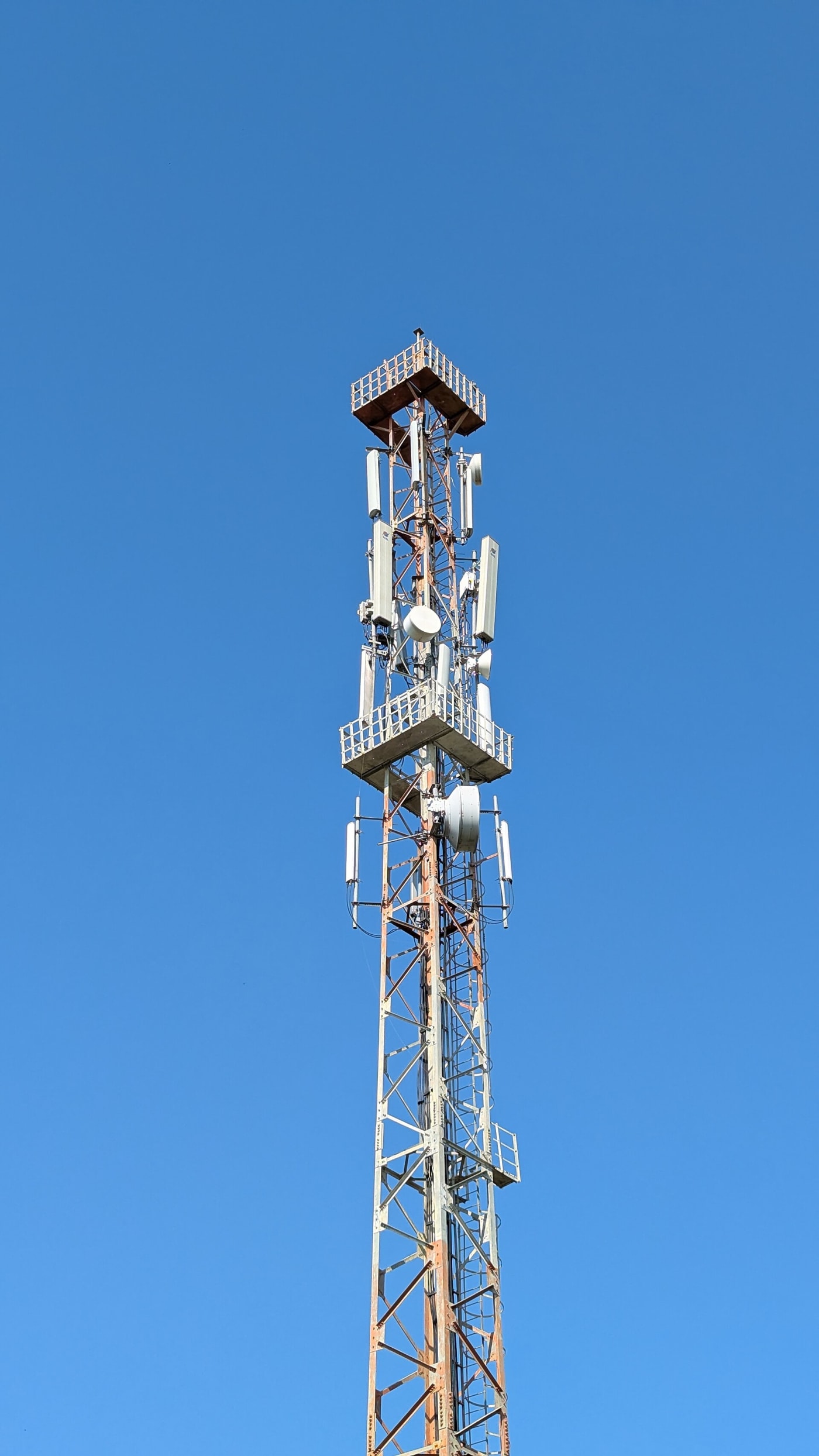 A detailed view of a BSNL 4G telecommunications tower showing the antenna array used for long-range radio signal transmission in modern mobi