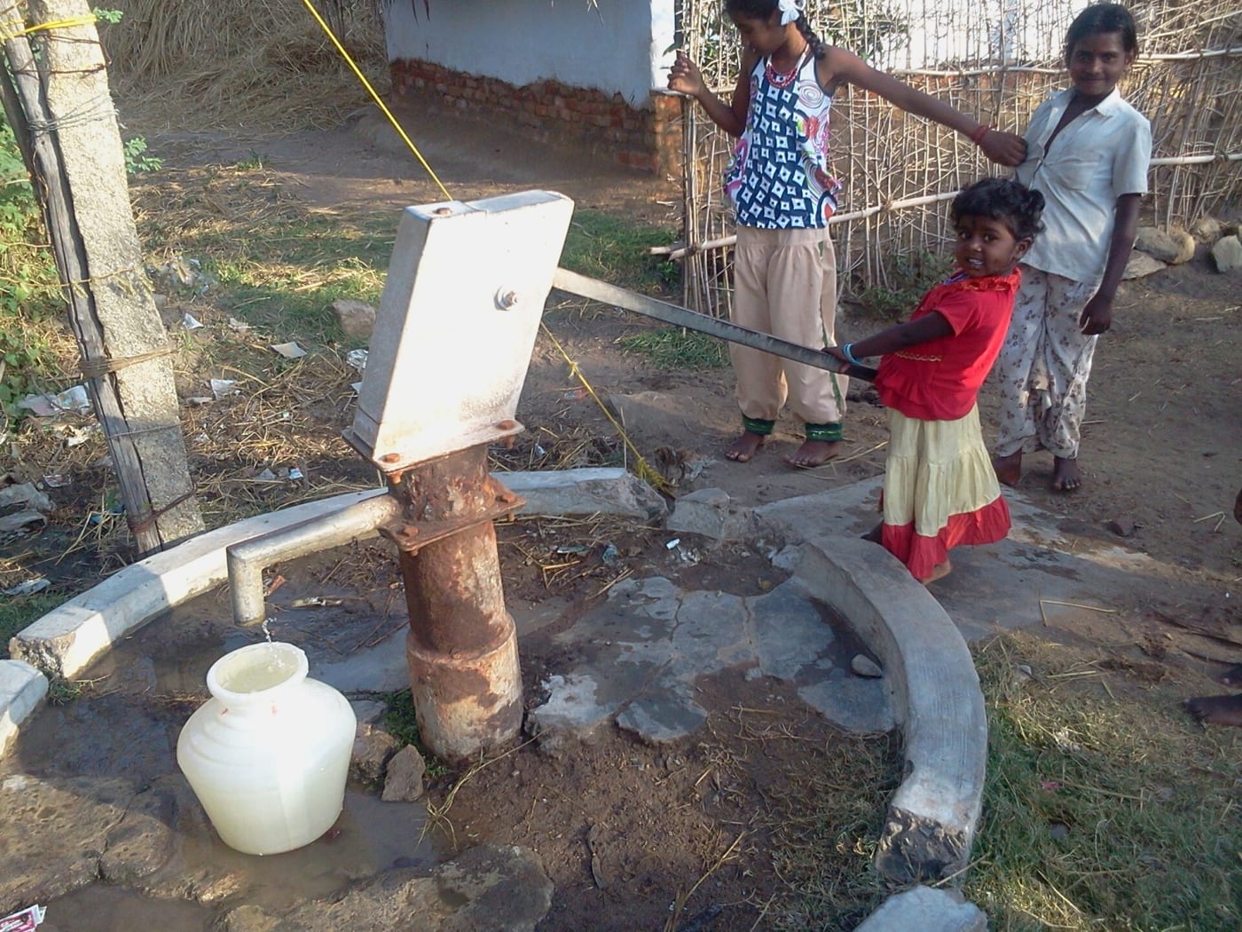 A child pumping water for their home. This photo taken at Kilikudy Village, Pudukkottai District, Tamil Nadu