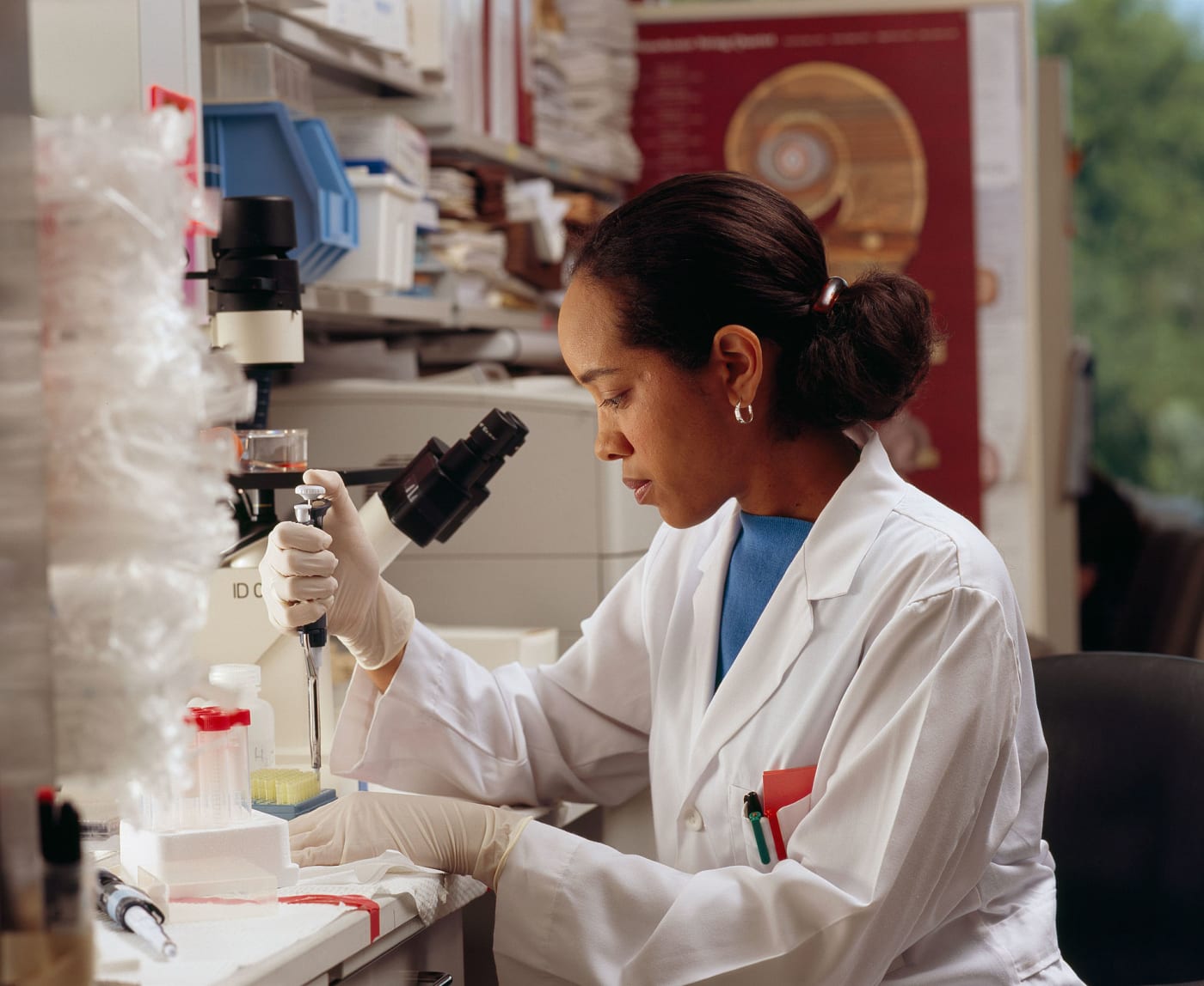 Researcher uses pipettes
