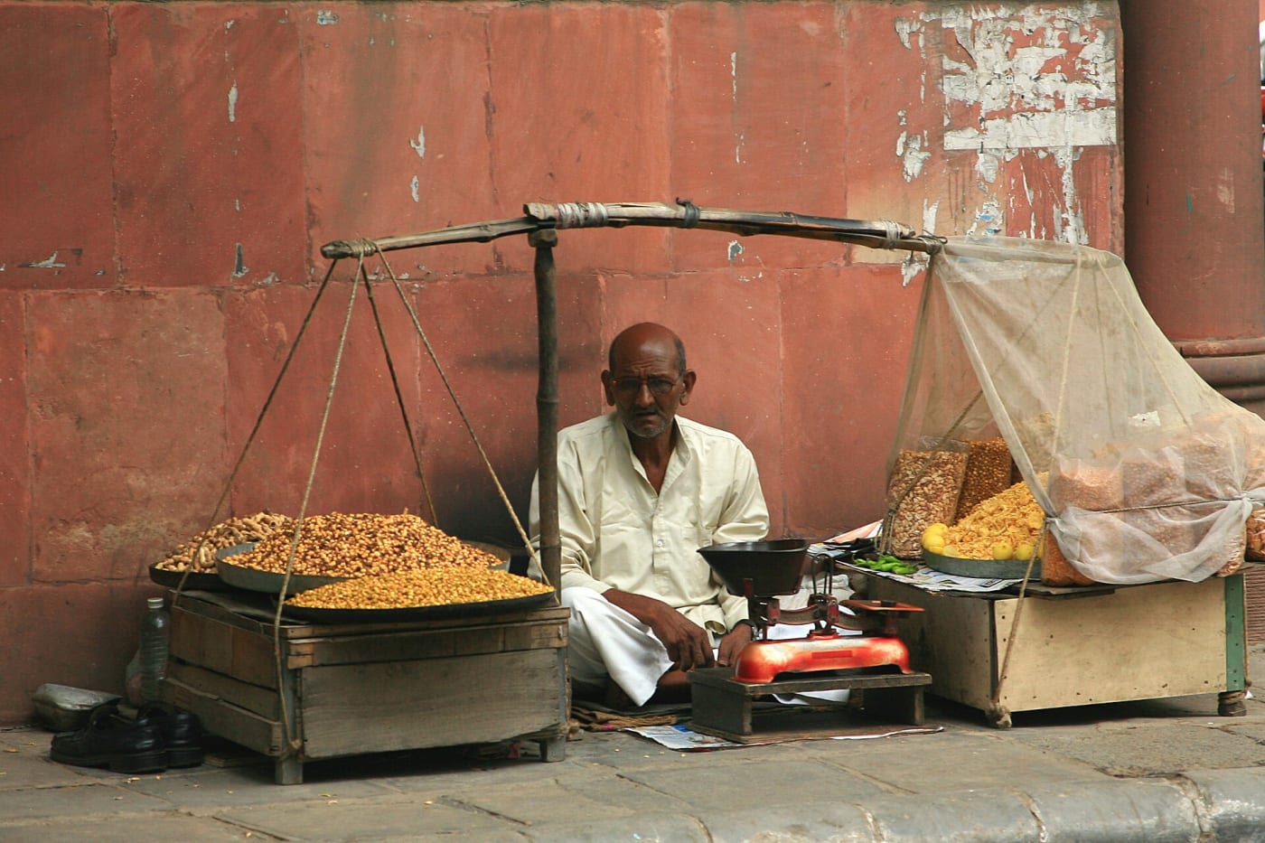 A merchant with a lot of nuts at Khan Market