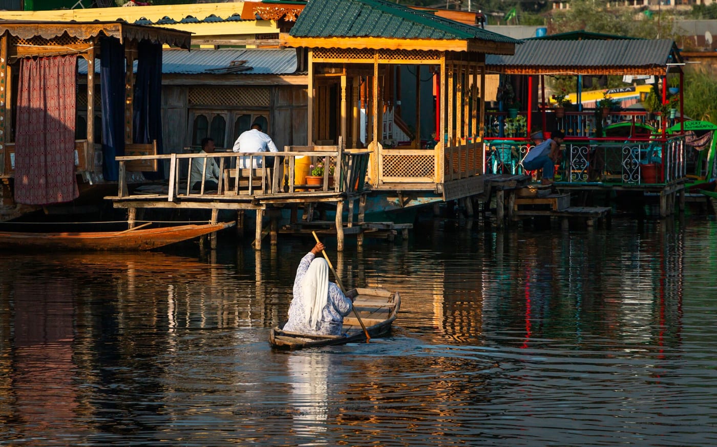 A Kashmiri lady rowing a shikara on Dal Lake