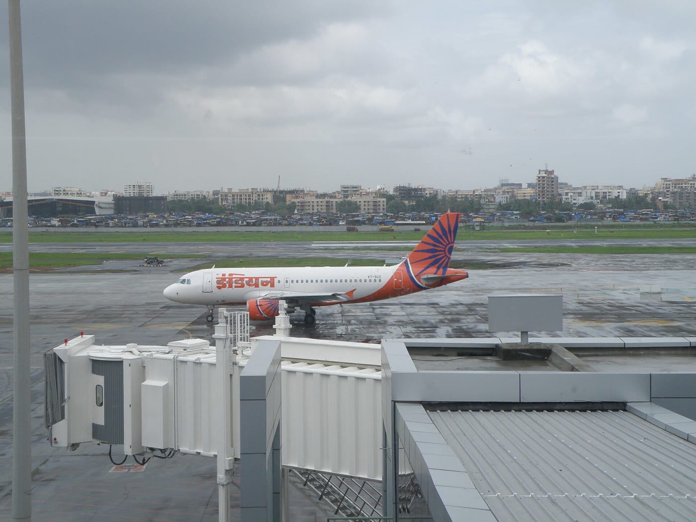 Air India aircraft VT-SCC in older 'Indian' livery outside domestic departure terminal 1C of Chhatrapati Shivaji International Airport