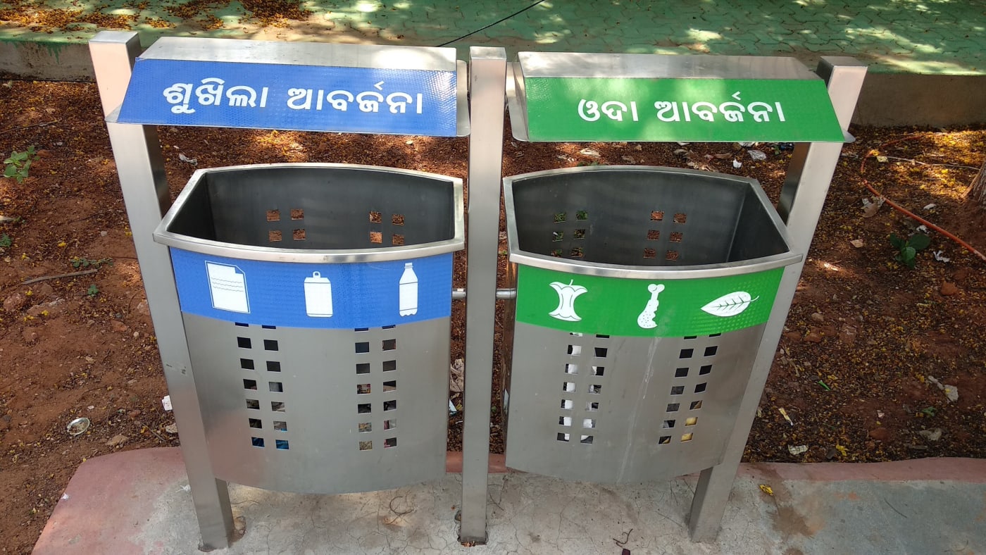 Separate bins for dry and wet waste at a bus stop in Shastri Nagar, Bhubaneswar, Odisha.