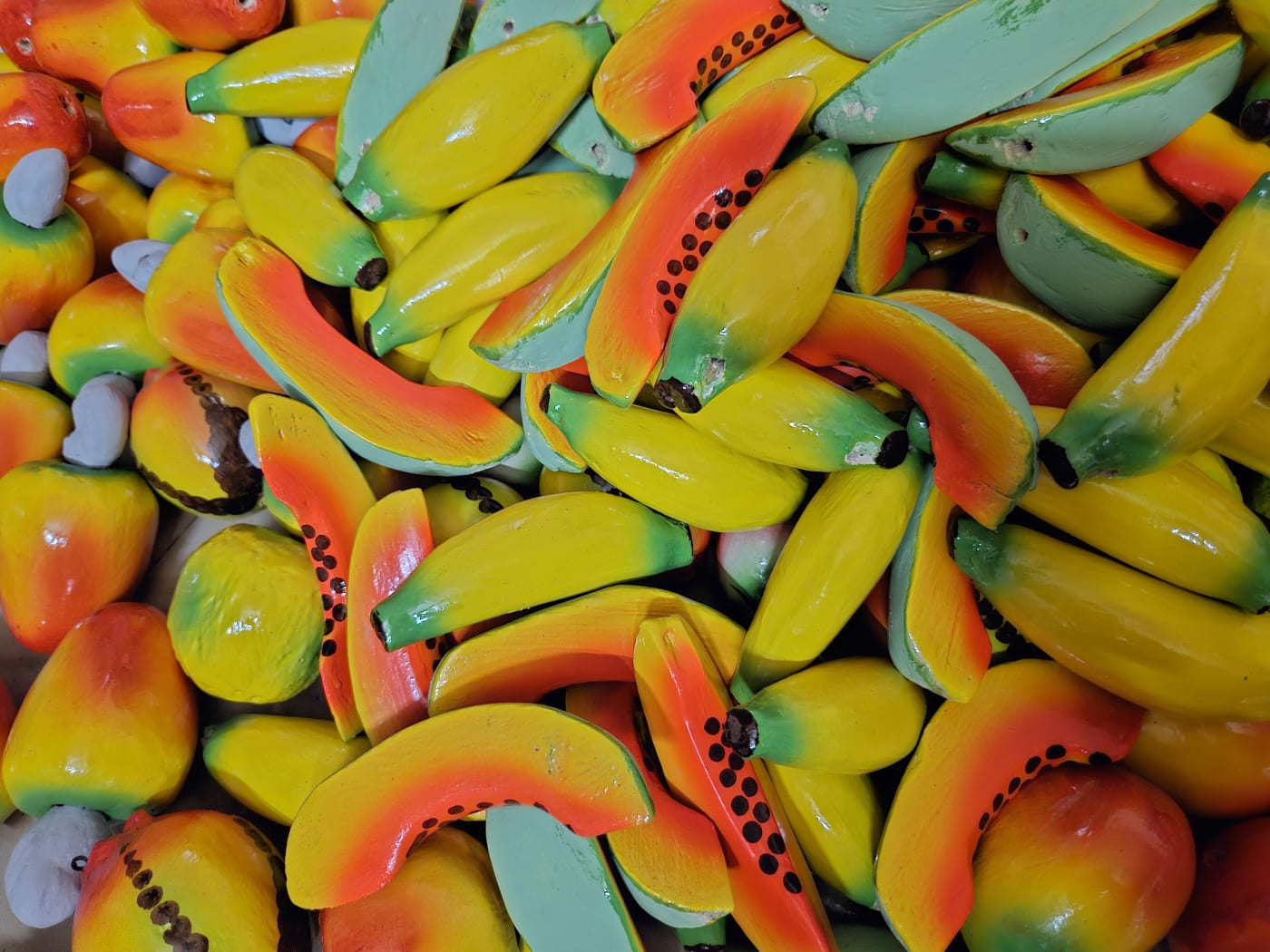 Hand-painted wooden toys shaped like local fruits such as mango and cashew apple, from the Konkan region of Maharashtra.